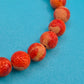 Vintage Armband aus rotem Korallen-Imitat mit dekorativem Knoten-Element