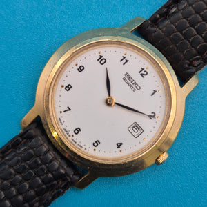Vintage Seiko Quartz Armbanduhr mit Datumsanzeige und Lederarmband