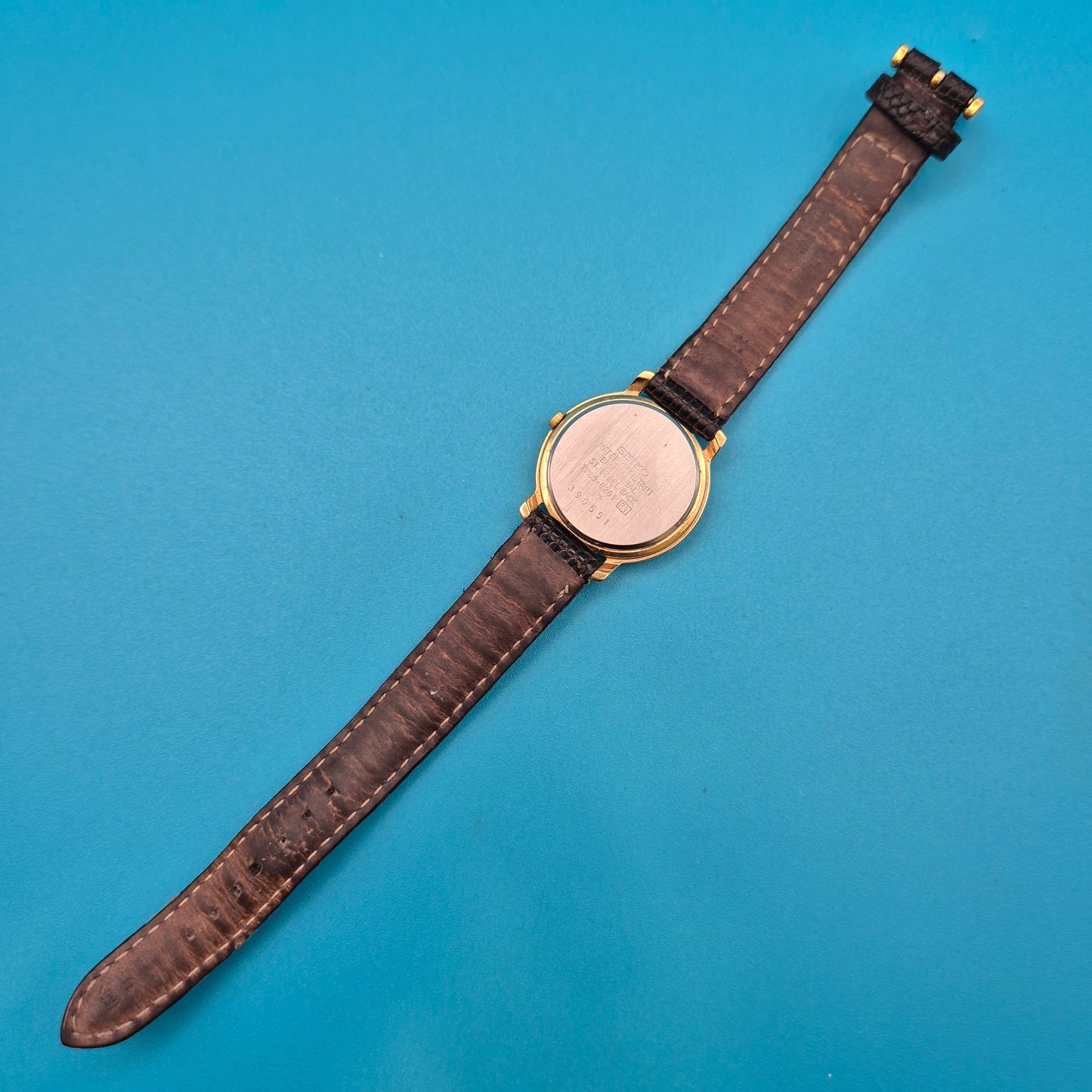 Vintage Seiko Quartz Armbanduhr mit Datumsanzeige und Lederarmband