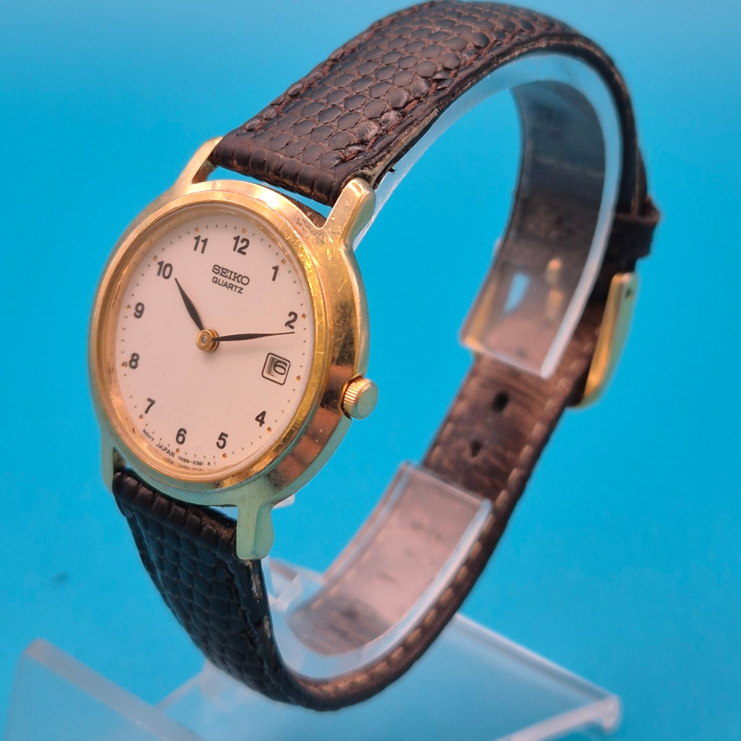 Vintage Seiko Quartz Armbanduhr mit Datumsanzeige und Lederarmband