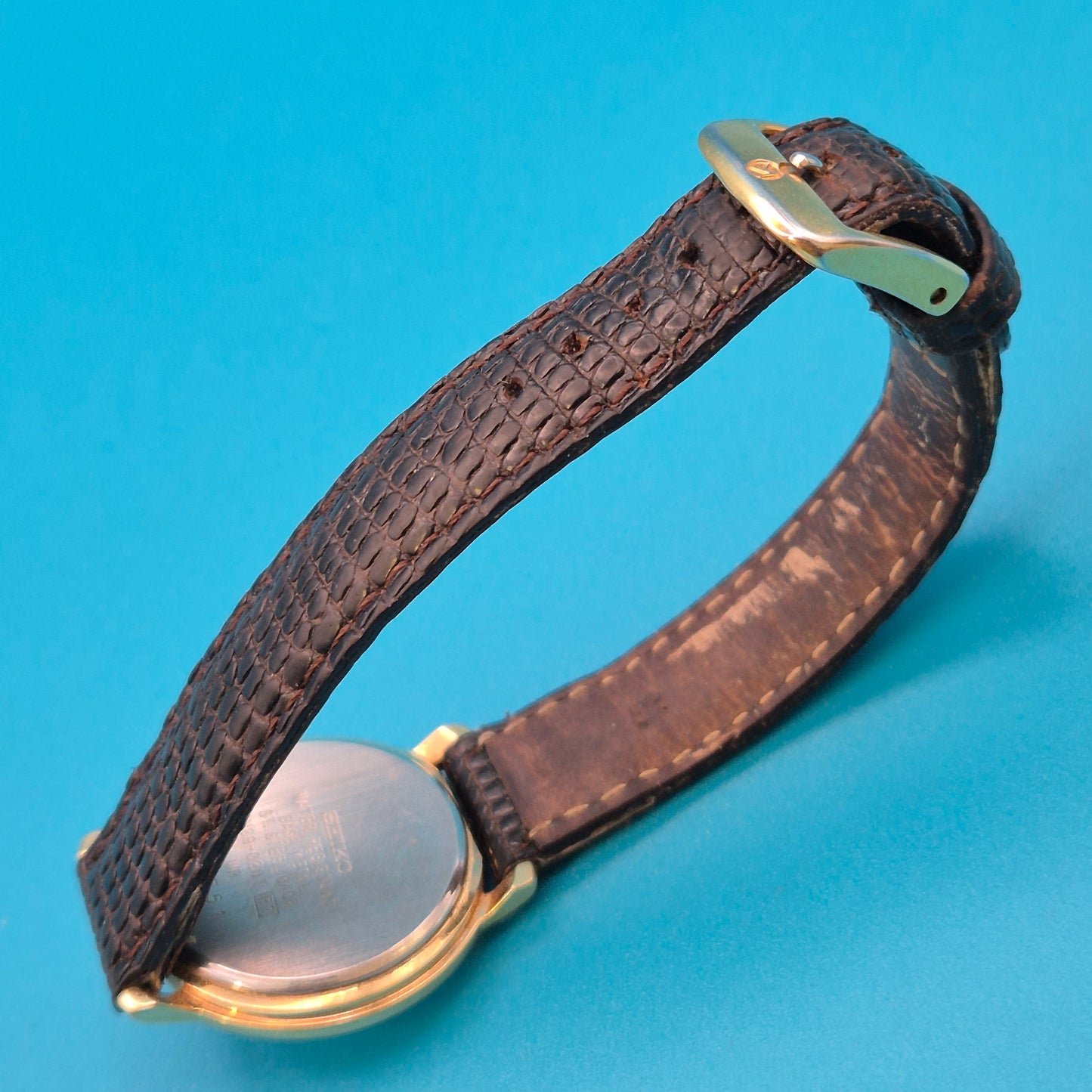 Vintage Seiko Quartz Armbanduhr mit Datumsanzeige und Lederarmband