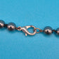 Elegante Vintage Kette mit anthrazitfarbenen Perlen & Tropfen-Anhänger