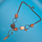 Vintage Statement-Kette mit Federn-Anhänger und Stein-Elementen in Kupfer-Optik