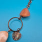 Vintage Statement-Kette mit Federn-Anhänger und Stein-Elementen in Kupfer-Optik