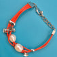 Mehrsträngiges Leder-Armband in Orange mit echten Perlen und Kristall-Details