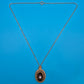 Antiker Anhänger mit schwarzem Inlay und Perle an filigraner Kette