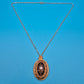 Antiker Anhänger mit schwarzem Inlay und Perle an filigraner Kette