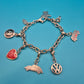 Vintage Volkswagen Charm-Armband mit diversen Anhängern und Logo