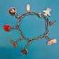 Vintage Volkswagen Charm-Armband mit diversen Anhängern und Logo