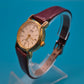 Vintage ADEC Quarz Armbanduhr mit bordeauxrotem Lederarmband