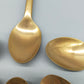 Sechs goldfarbene Löffel mit Anker-Motiv Maritimes Vintage-Besteck