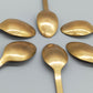 Sechs goldfarbene Löffel mit Anker-Motiv Maritimes Vintage-Besteck