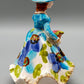 Vintage Porzellan Musical Figurine Elegant gekleidete Dame Blumenkorb