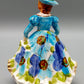 Vintage Porzellan Musical Figurine Elegant gekleidete Dame Blumenkorb