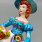 Vintage Porzellan Musical Figurine Elegant gekleidete Dame Blumenkorb