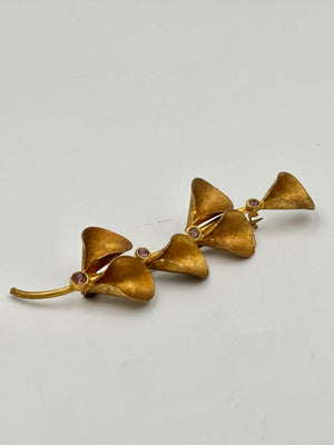 VINTAGE Goldfarbene Brosche mit Violetten Steinen