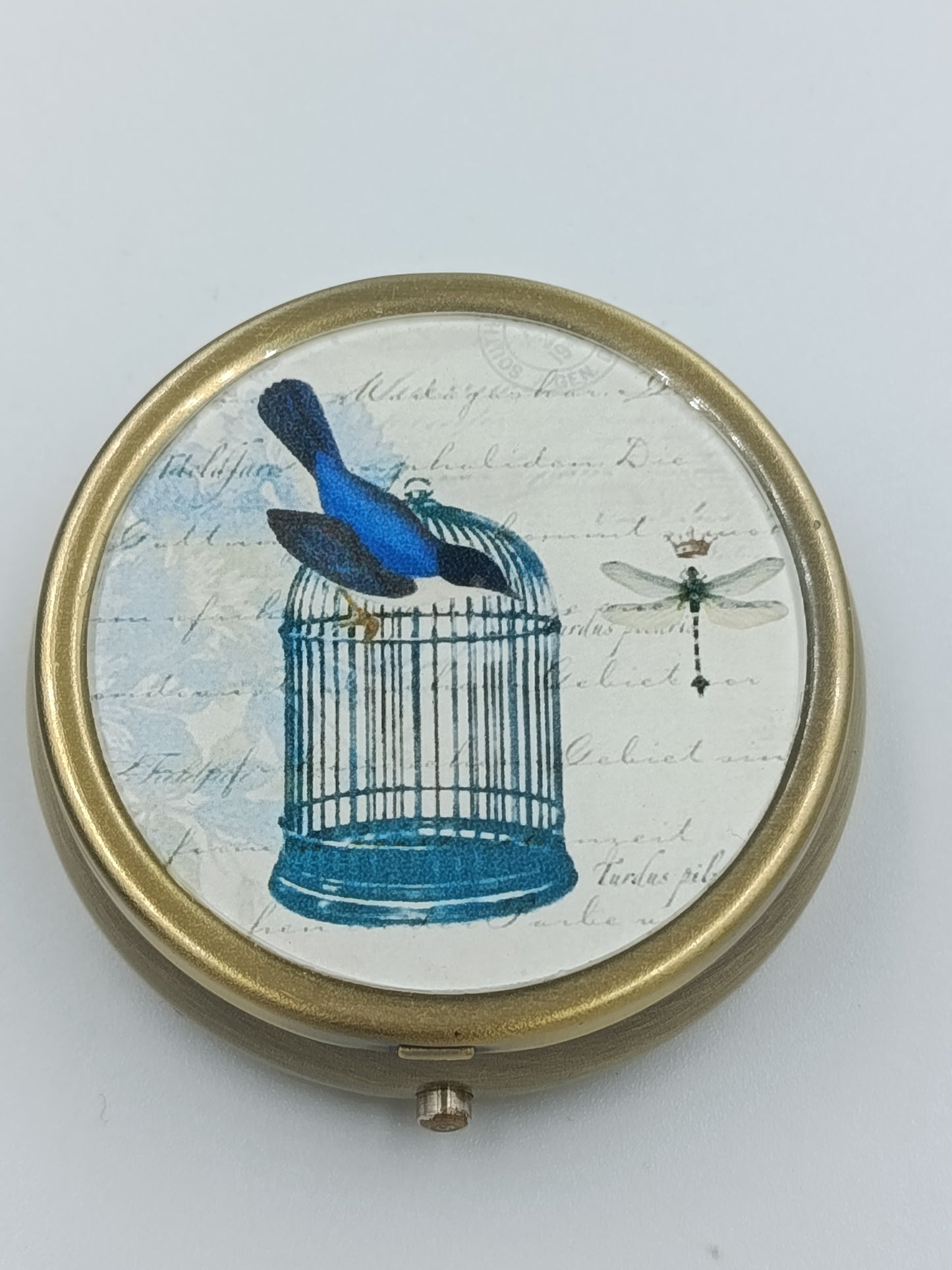 Runde Vintage-Dose mit Vogel- und Käfig-Motiv