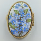 Ovale Porzellandose mit Vergissmeinnicht-Motiv