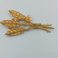 Goldfarbene Ähren-Brosche mit Emailblüten
