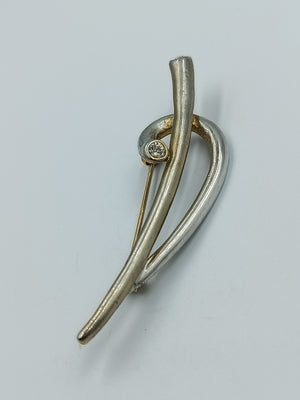Moderne geschwungene Brosche mit Strass