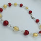 Glasperlenkette in Rot & Gold mit Silberdetails