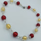 Glasperlenkette in Rot & Gold mit Silberdetails