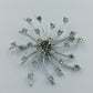 Strahlenförmige Vintage-Brosche in Silberoptik mit Strass