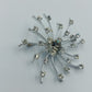 Strahlenförmige Vintage-Brosche in Silberoptik mit Strass