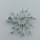 Strahlenförmige Vintage-Brosche in Silberoptik mit Strass