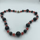 Lava-Perlenkette mit roten Kristall-Highlights