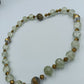 Glasperlenkette in Grün-Gold mit Strassverschluss