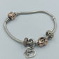 Pandora Armband mit Charms in Silber & Roségoldoptik