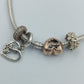 Pandora Armband mit Charms in Silber & Roségoldoptik