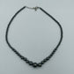 Halskette aus Hämatit-Perlen in Verlaufoptik