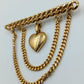 Goldfarbene Brosche mit Herz-Anhänger und Kettendetails