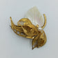Elegante Vintage-Brosche mit Perlmuttblatt und Goldfiligran