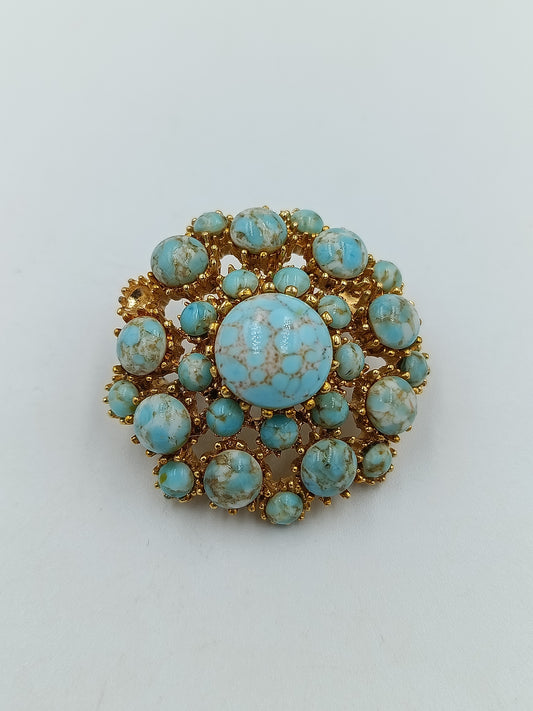 Vergoldete Brosche mit türkisfarbenen Steinen im Vintage-Design