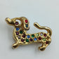 Goldfarbene Brosche „Dackel“ mit bunten Strasssteinen