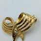 Elegante goldfarbene Brosche mit Strassakzent