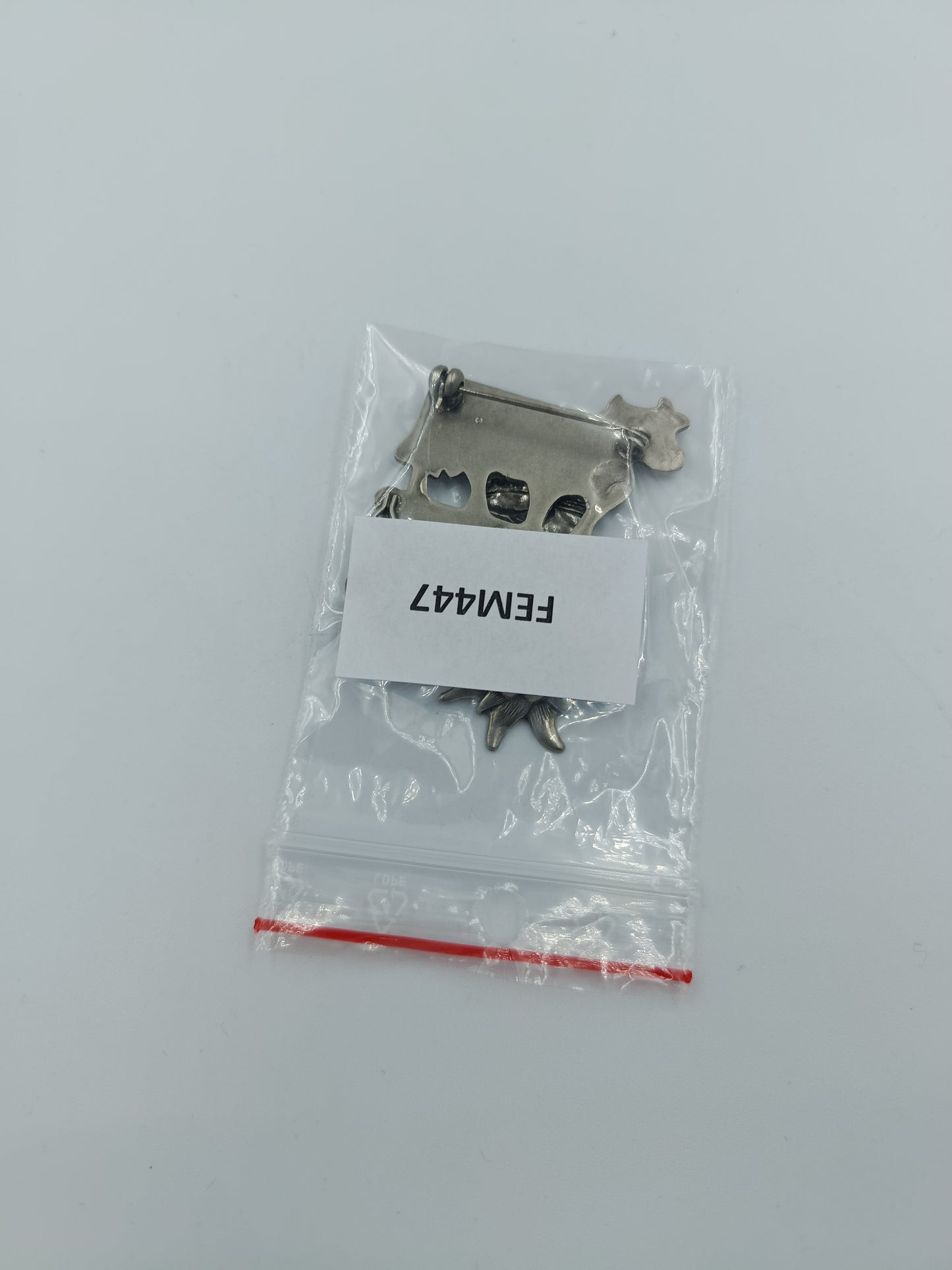 Trachtenbrosche „Kuh mit Anhängern“