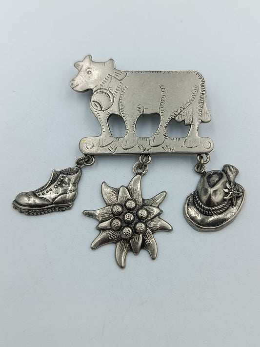 Trachtenbrosche „Kuh mit Anhängern“