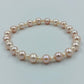 Perlenarmband in zarten Rosé- und Cremetönen