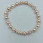 Perlenarmband in zarten Rosé- und Cremetönen