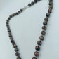 Halskette mit Natursteinperlen in Schwarz Braun Marmoroptik