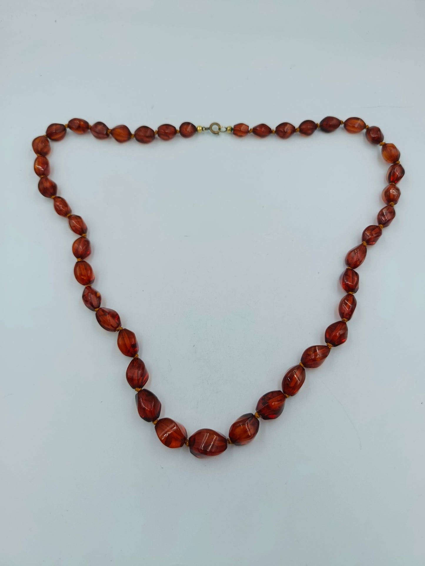 Bernsteinfarbene Perlenkette mit Goldakzenten