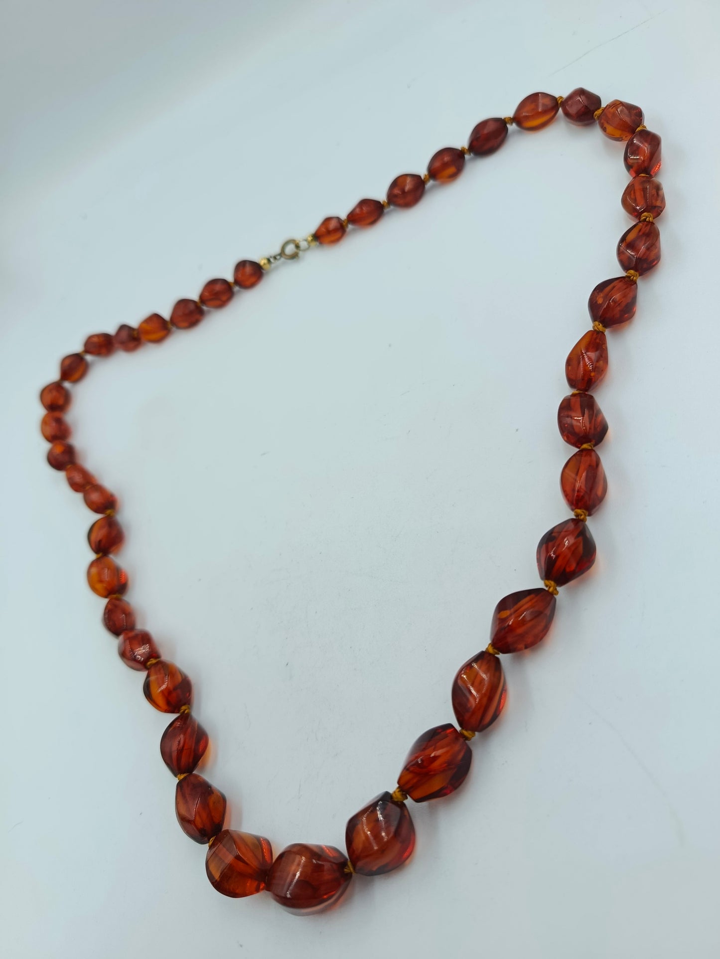 Bernsteinfarbene Perlenkette mit Goldakzenten