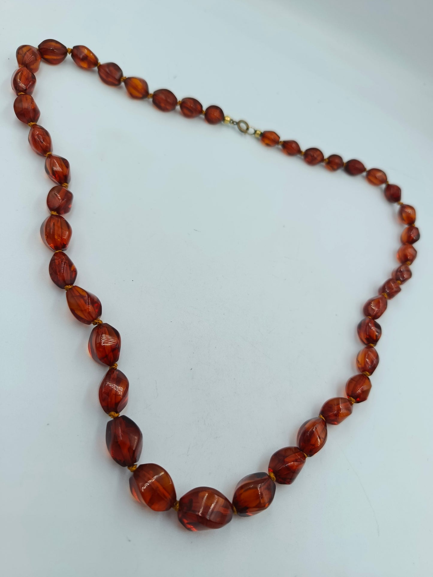 Bernsteinfarbene Perlenkette mit Goldakzenten