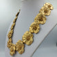 Opulente Statement Kette in Goldblüten Design