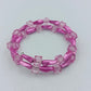 Elastisches Armband Rosa mit transparenten Würfelperlen