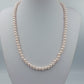 Klassische Perlenkette in zartem Roséton